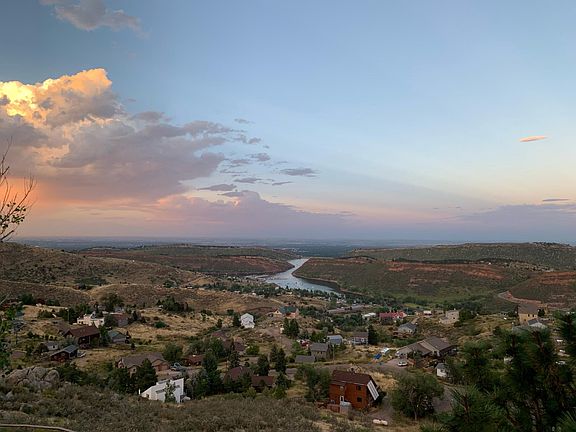 View from upper deck looking East in May with Horsetooth Reservoir and Pawnee Buttes 75 miles away in view