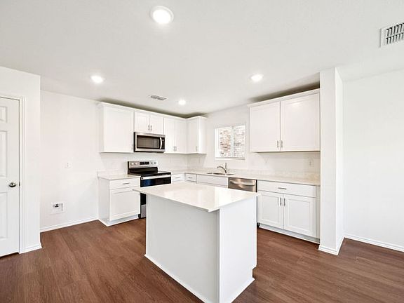 Eat-in island kitchen photos are not of actual home, some features vary