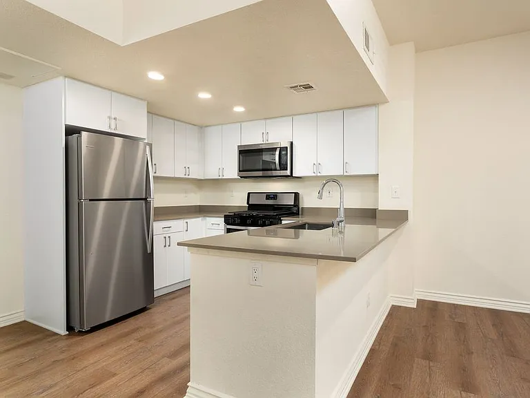 Renovated Package I kitchen and dining area with hard surface flooring