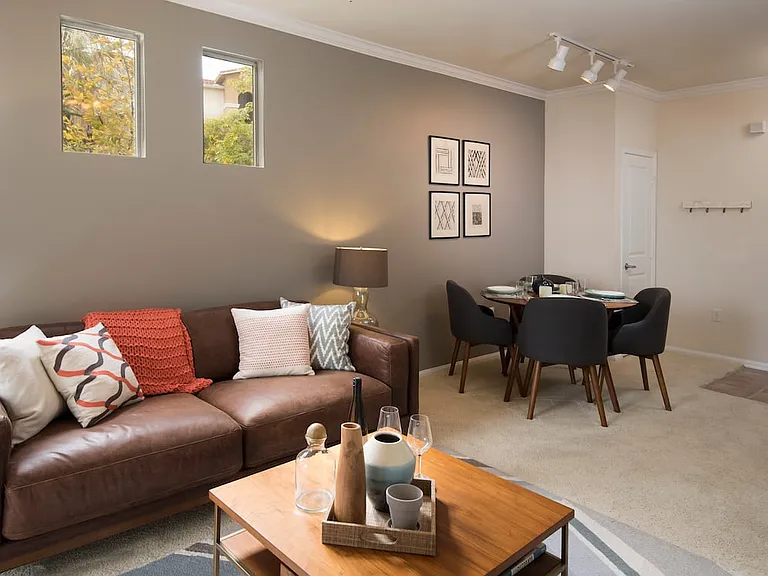 Classic Package I dining and living area with carpeting