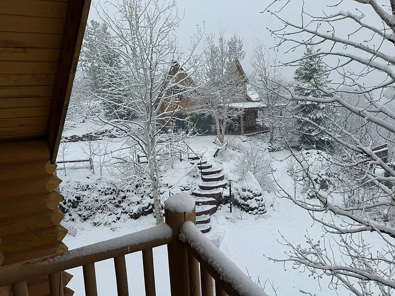 View of the property with snow