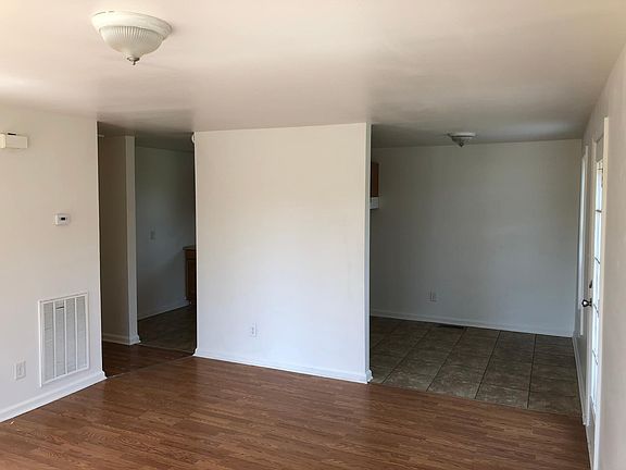 View from living room into dining (Right) and Kitchen (Left)