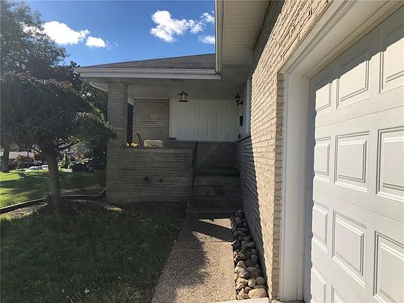 Front Approach. This is the view as you approach the front door. The garage door is newer and decorative stones frame the sidewa