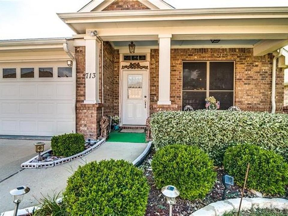 Lush landscaping and a front covered porch!