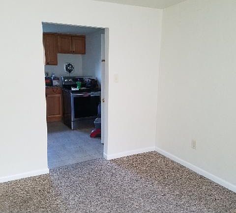 Living room looking into kitchen