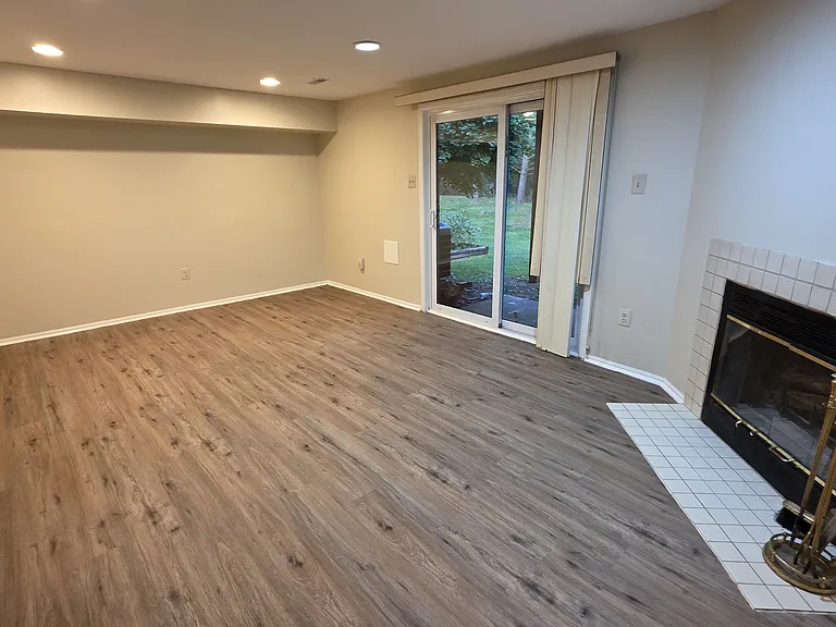 Spacious Rec Room or 4th Bedroom and exits the rear of the property.