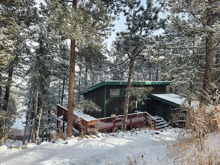 This is our home, next door about 50 feet. The two homes are sound-proof from one another.