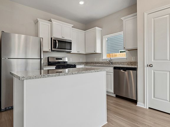 This home includes a chef-ready kitchen with granite counters, stainless appliances!