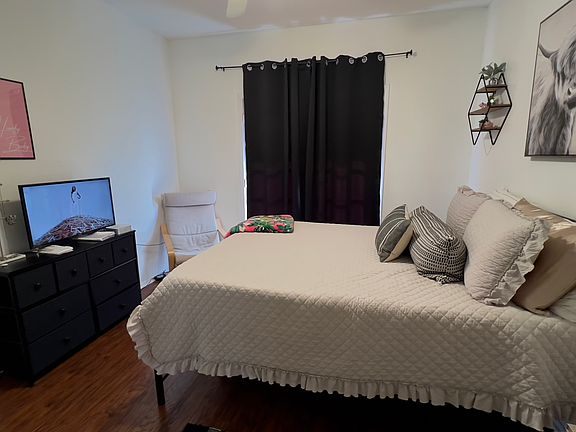 Room 1 has a walk-in closet and its private bathroom. The French door behind the curtain leads to a balcony.