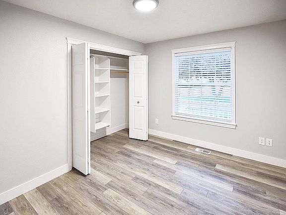 second bedroom with generous closet space facing the front street
