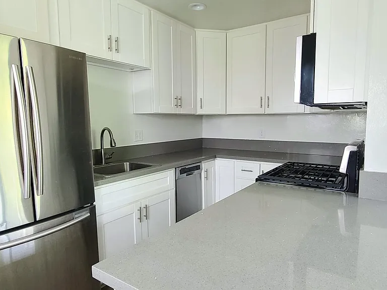 Quartz Counters. Stainless Appliances include Dishwasher, Fridge, Range/Oven, and Microwave