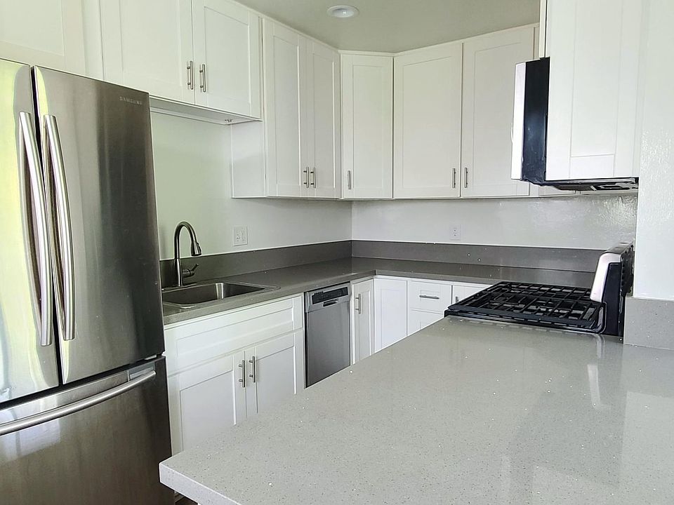 Quartz Counters. Stainless Appliances include Dishwasher, Fridge, Range/Oven, and Microwave