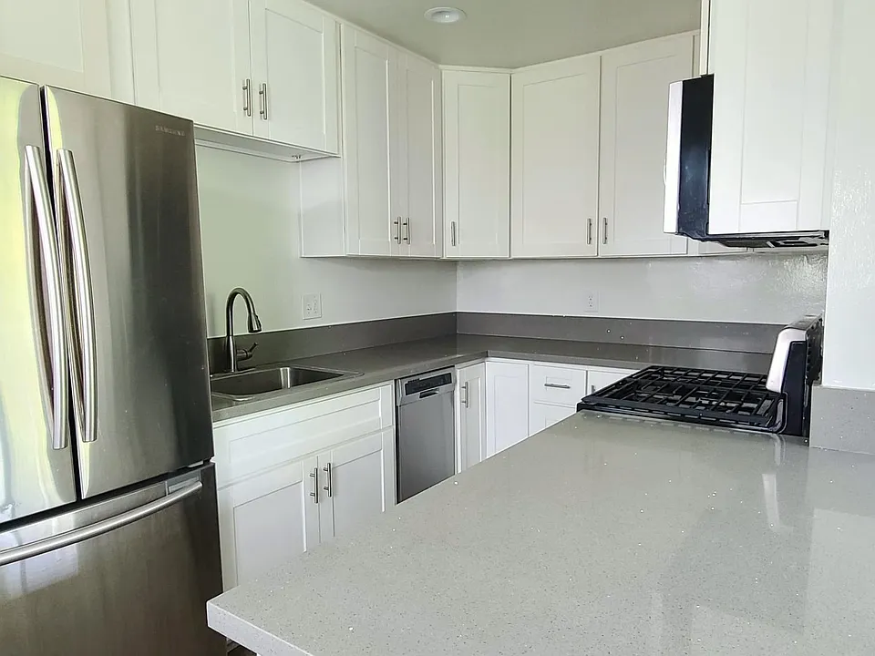 Quartz Counters. Stainless Appliances include Dishwasher, Fridge, Range/Oven, and Microwave
