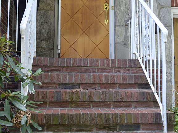 stone sheltered front porch entry 