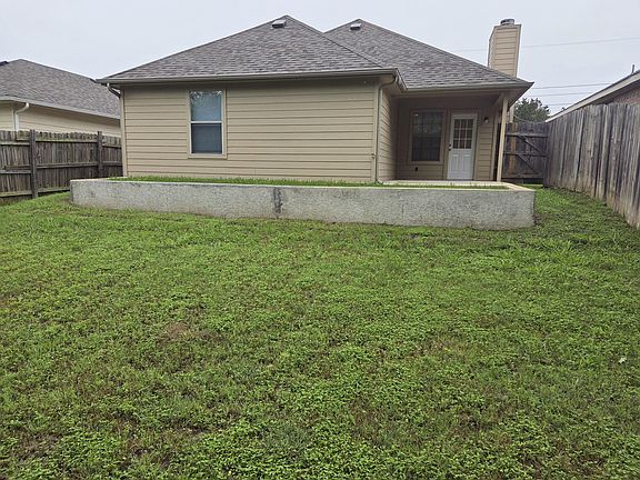Back view, Large yard with covered patio