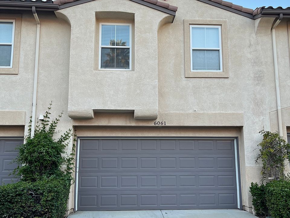 Back exterior of the townhouse with the two car garage.