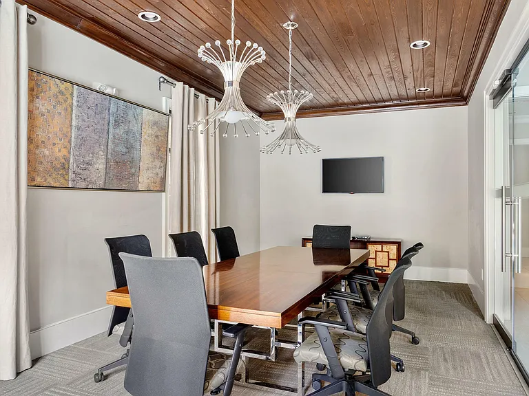 Step into elegance with this beautifully designed conference room, perfect for productive meetings.