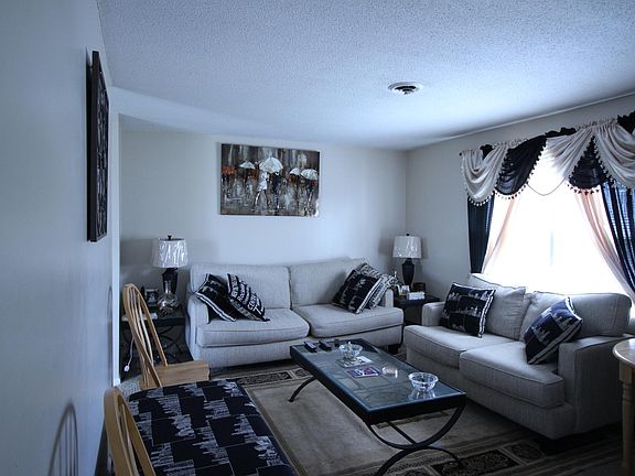 Living Room, connects to kitchen and hallway to Bedrooms. Nice large window.