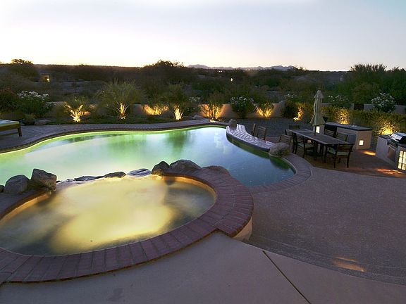 Self-cleaning salt water Pebble Tec pool, swim up bar, spa w/waterfall.