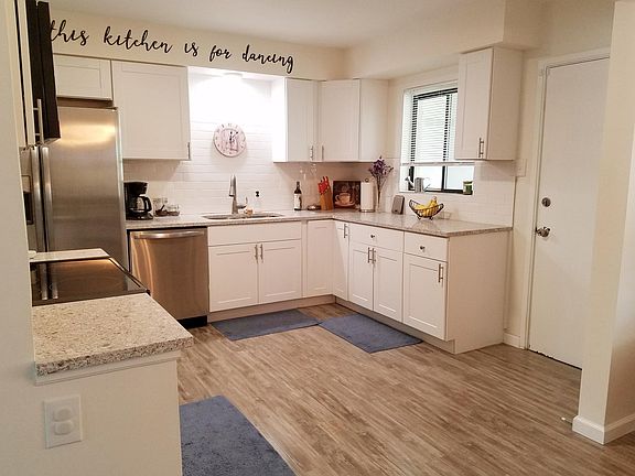 Kitchen with window and door to the back yard patio