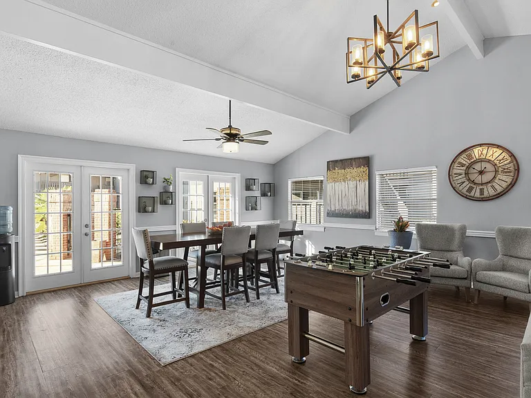 Fun and socializing come easy in the community game room at Lakeland East Apartments in Flowood, MS. Managed by Highlands Vista Group.