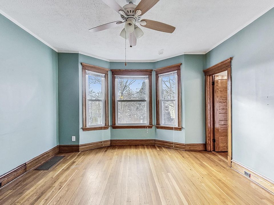 Main living room gets amazing natural light. Door on the right is to a bedroom