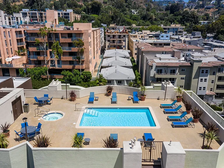 Apartments in Hollywood, CA - Elevated View of Pool, Jacuzzi, Patio with Lounge Chairs and Tables with view of Surrounding Areas summit.