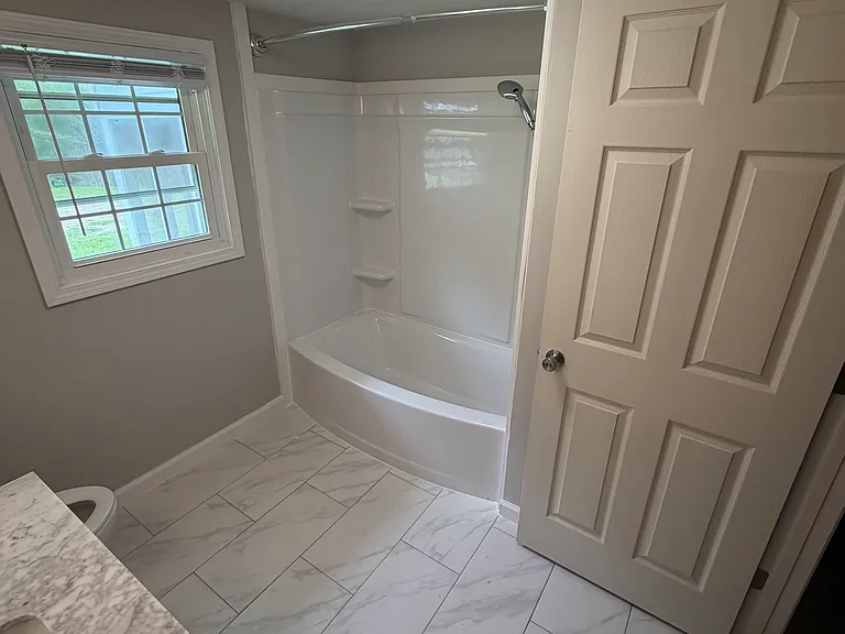 new rounded tub and tile floors