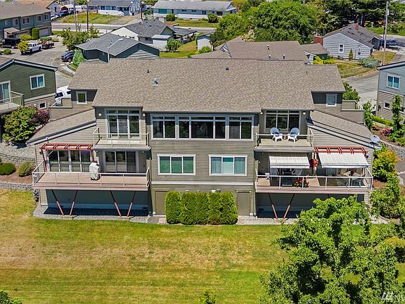 The wall of windows on the top floor, and the two decks on the upper floor are all yours! 
