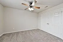 The carpet has now been replaced with vinyl plank solid wood looking floors.Walk in closet, in room bathroom, no carpet. Vinyl wood looking plank, ceiling fan, 2 inch faux wood blinds