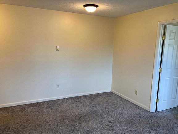 living/dining area view from kitchen. Door leads to the bedroom
