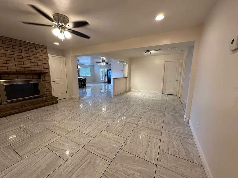 Wood burning fireplace in Living Room with large open area to kitchen and Family Room and Dining Room