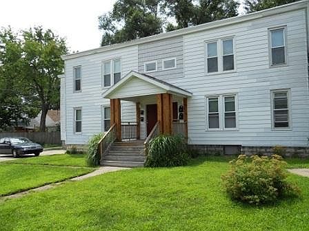 Building front with off street parking and covered front porch
