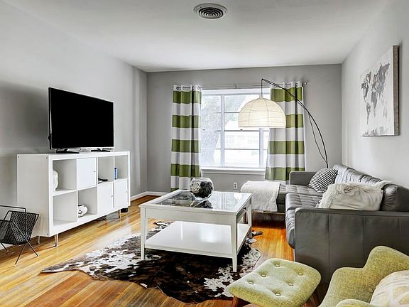 Another view of the living area. Large windows that looks out to the front.