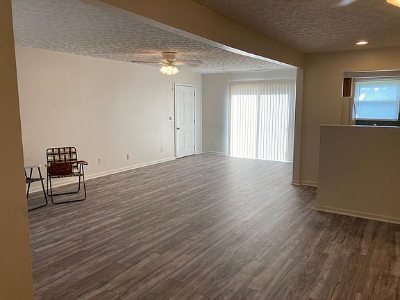 Living Room and Dining Room open concept area with door to garage