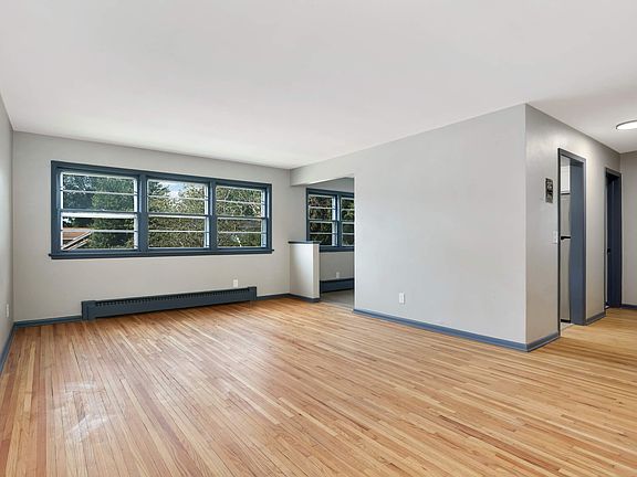 The available unit has carpet instead of hardwood floors.