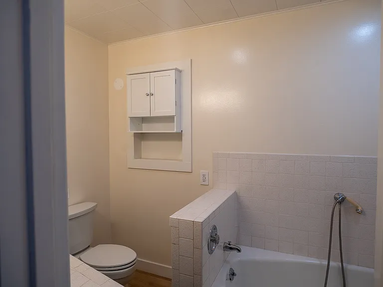 Off the laundry room is a full bathroom including vanity, bathroom toilet.