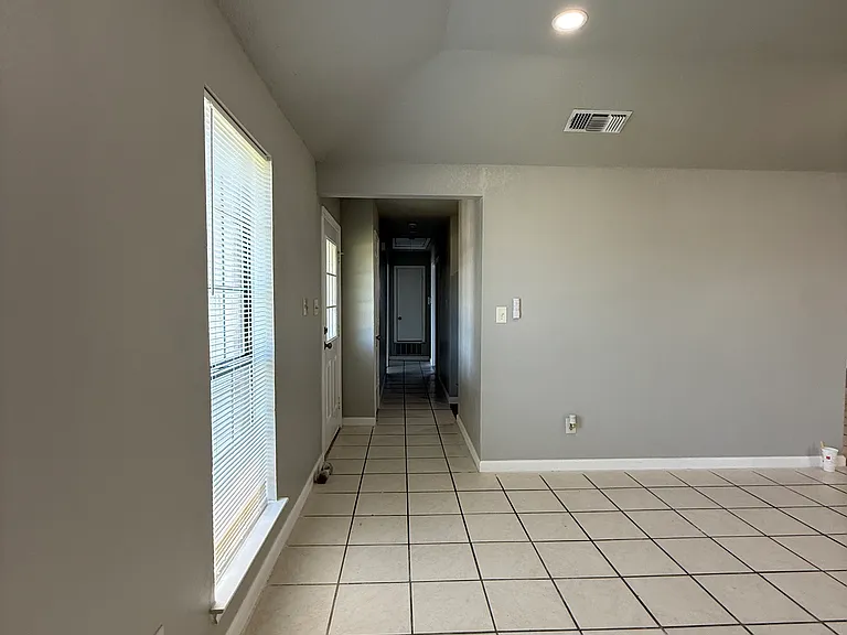 Hallway to bedrooms from living space