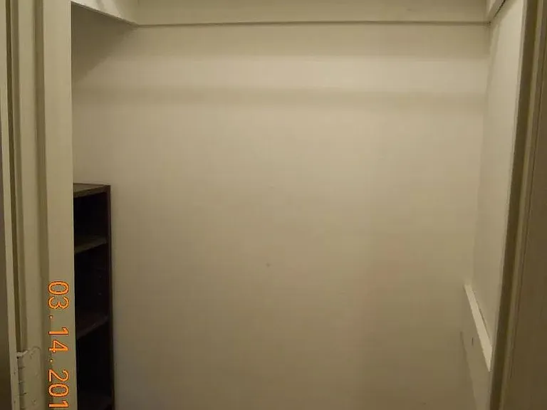 guest bedroom with private bathroom and closet