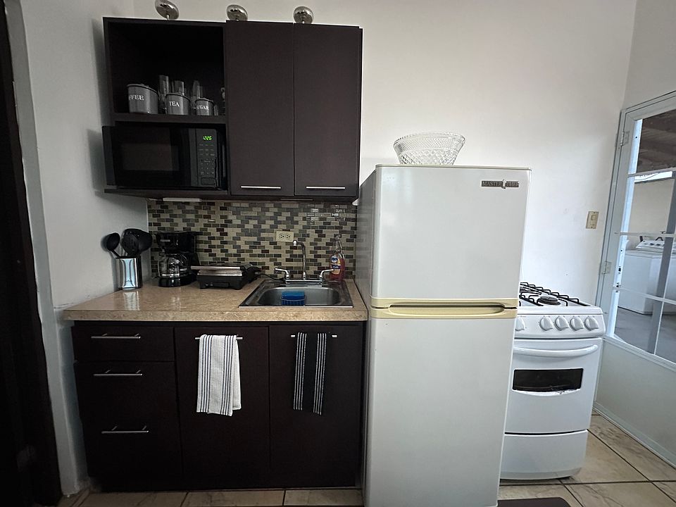 Fully equipped kitchen with pots, dishes, glasses, etc...