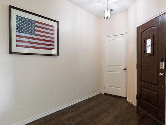 Inside the entry you find these gorgeous floors and access to the garage.