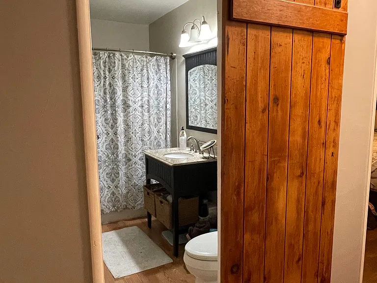 Barn door hallway bathroom - it latches.