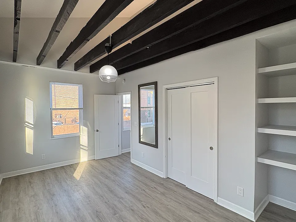 Spacious, bright bedroom with lots of room for your bed, dressers, and a desk. Built-in storage next to the closet.