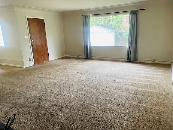 living room (fireplace at your back in this photo) - door to backyard (fully fenced in - private for this unit)