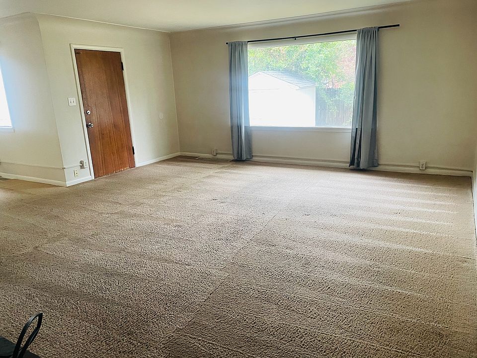 living room (fireplace at your back in this photo) - door to backyard (fully fenced in - private for this unit)