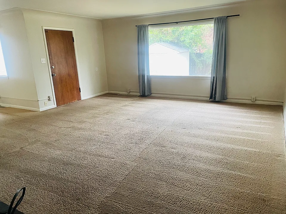 living room (fireplace at your back in this photo) - door to backyard (fully fenced in - private for this unit)