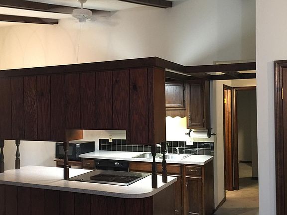 Galley Kitchen with range, microwave, dishwasher, side by si