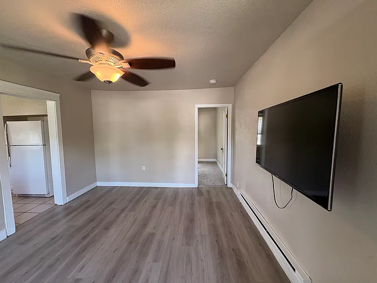 living room with view to kitchen and bedroom 1