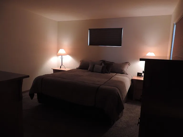 Master bedroom has blackout shades in the windows.