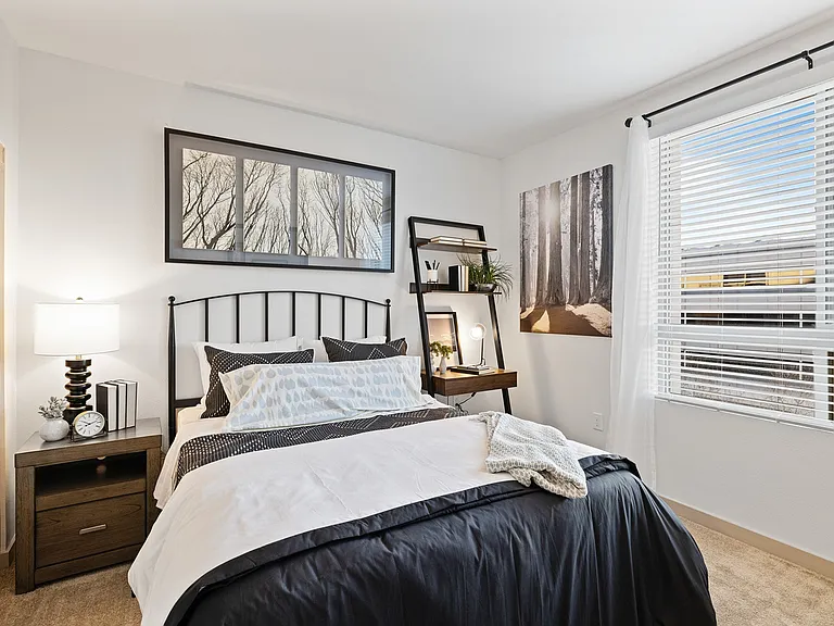 Wake up to comfort in this cozy bedroom filled with light and warmth.